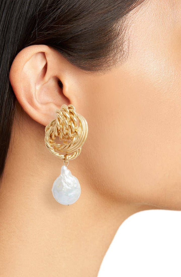 Clip on earrings with flat pearl drop