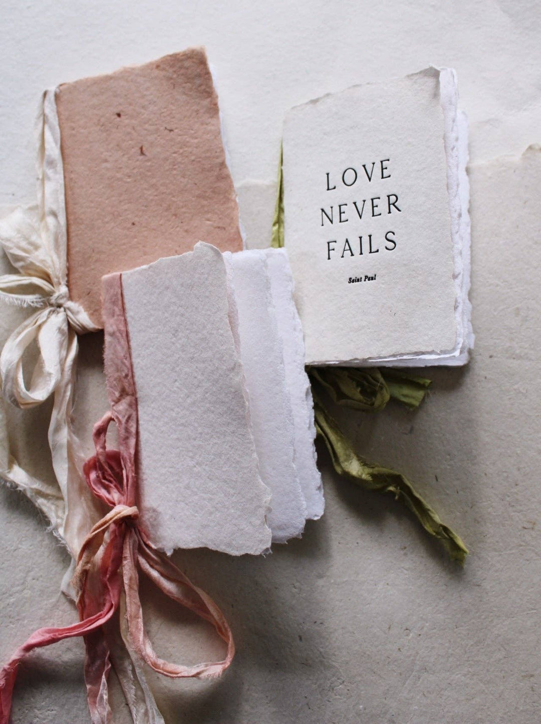 Blush paper with pink silk ribbon